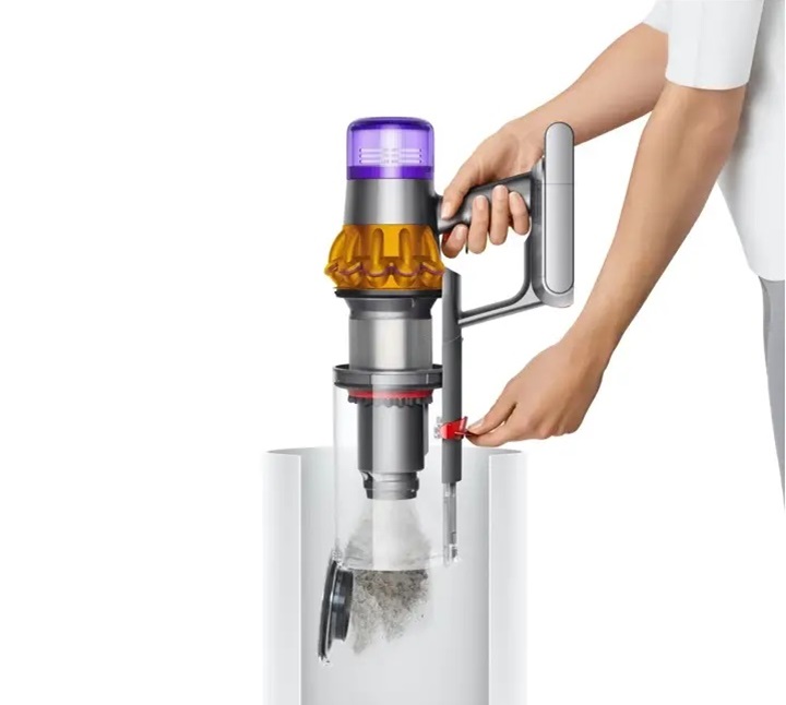 Dyson V15 Total Clean ejection mechanism driving dust into a bin.